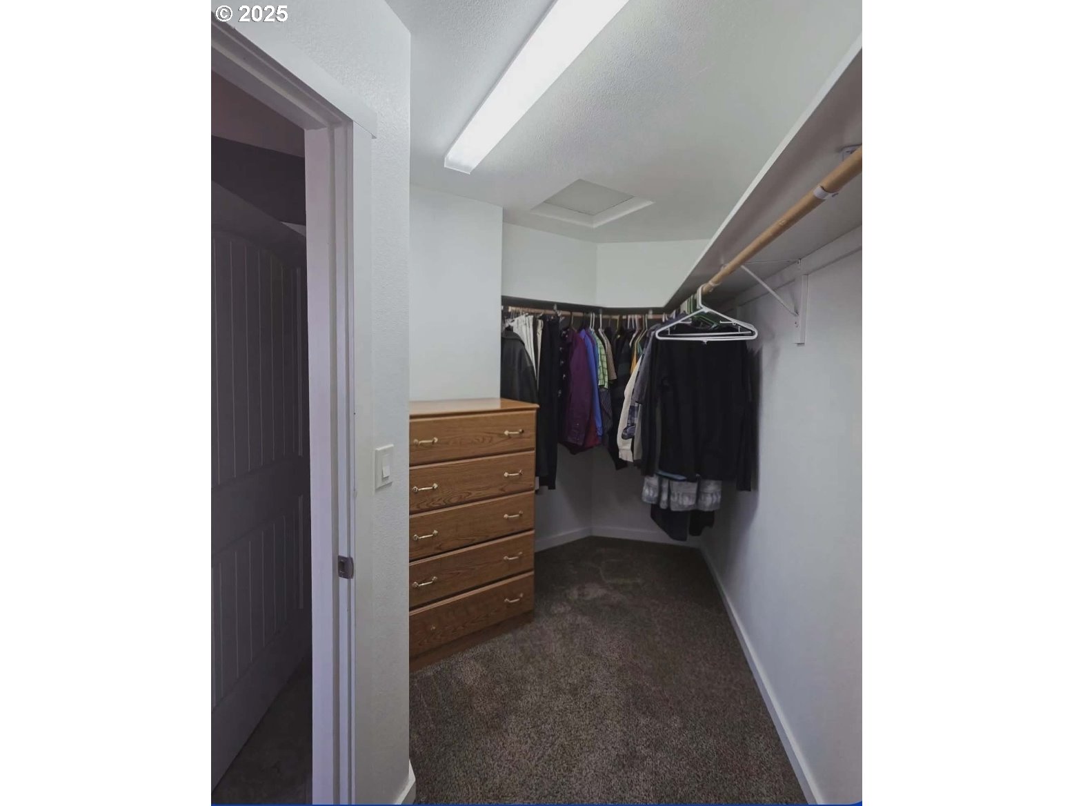 1010 Raechel Road Lakeside, OR 97449 - Photo 33 of 44 a view of walk in closet with clothes