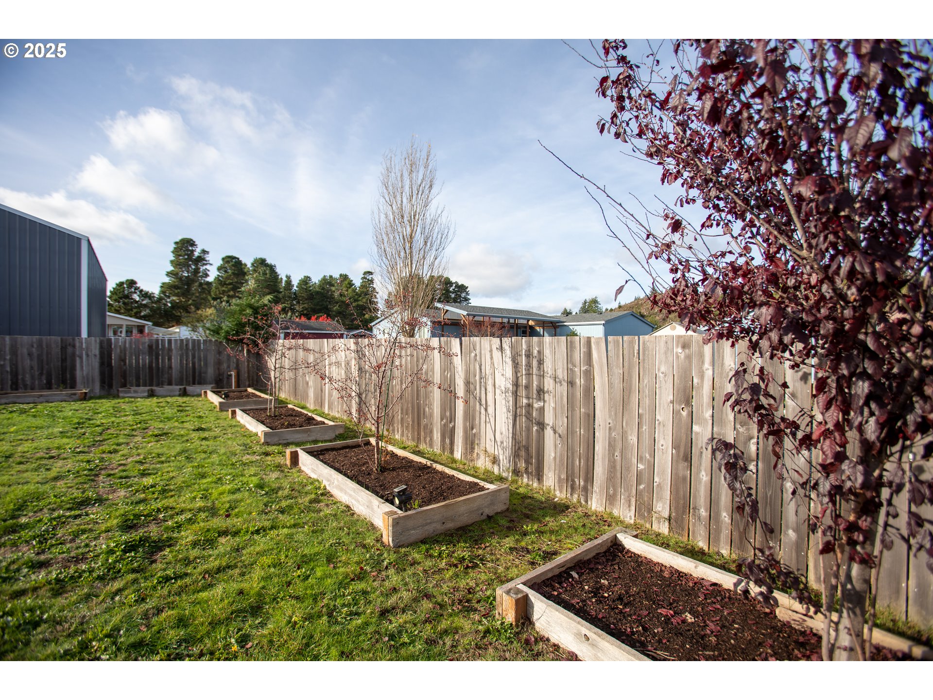 1010 Raechel Road Lakeside, OR 97449 - Photo 36 of 44 a view of backyard with wooden fence