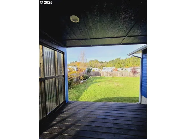 a view of a green field with outside view