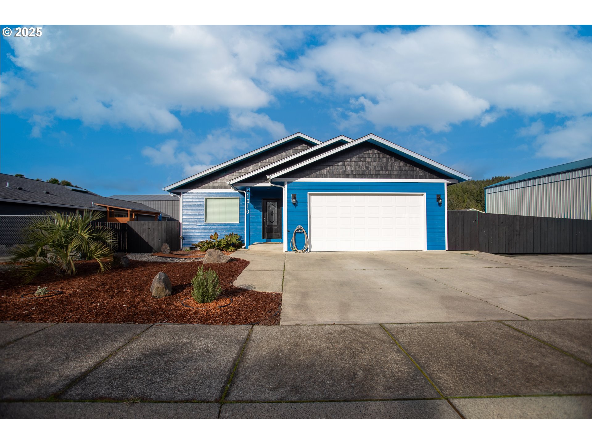 1010 Raechel Road Lakeside, OR 97449 - Photo 7 of 44 a front view of a house with a yard