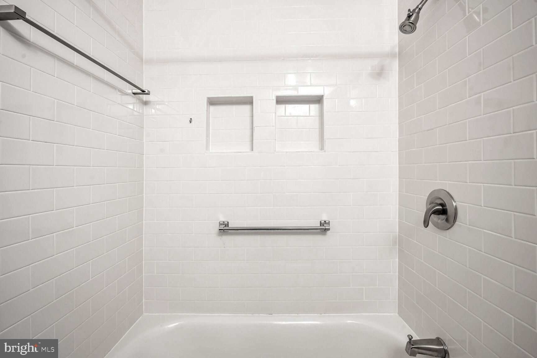 1669 Columbia Road Northwest, Unit 202 Washington, DC 20009 - Photo 11 of 13 Built ins and grab bars in full tub/shower.