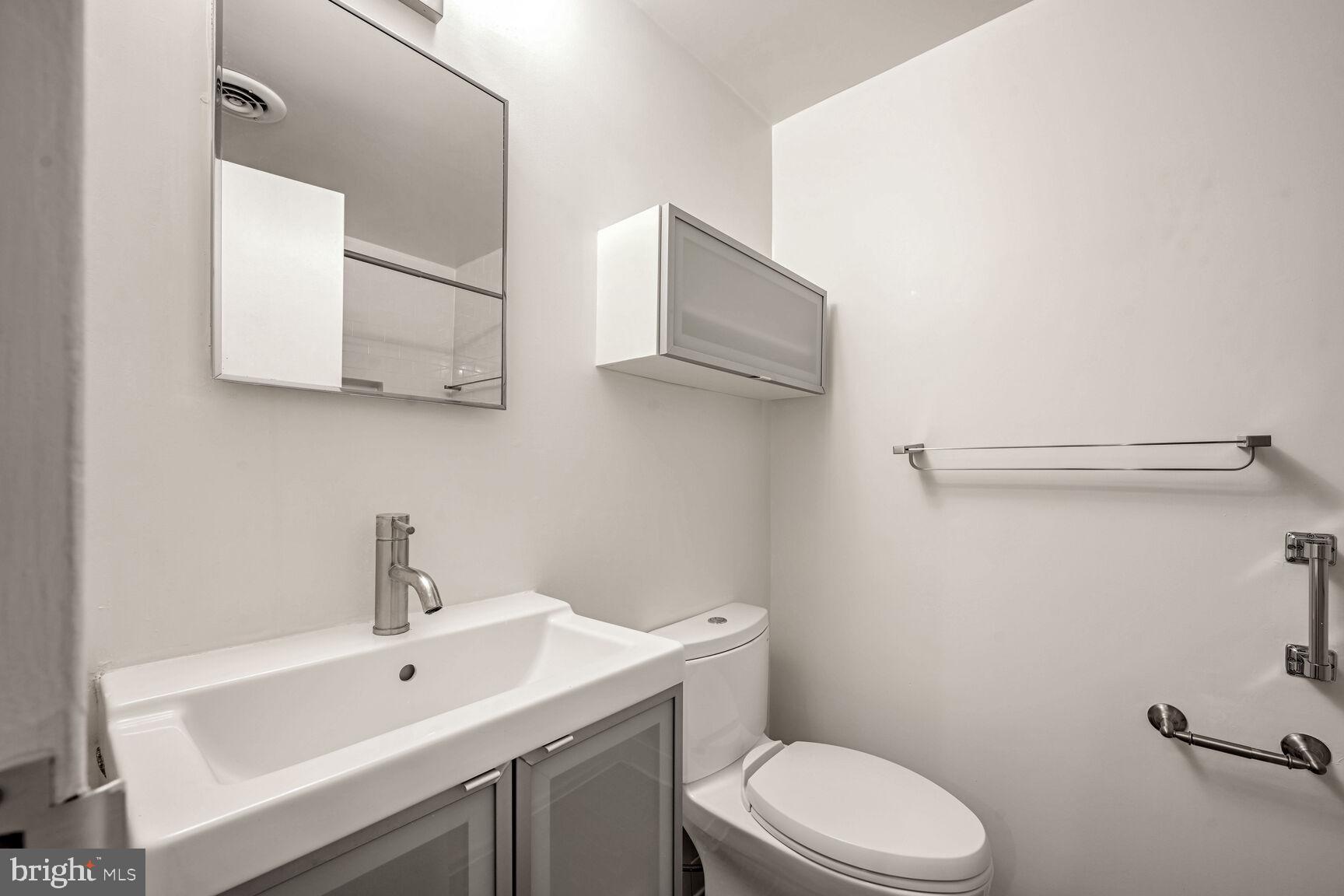 1669 Columbia Road Northwest, Unit 202 Washington, DC 20009 - Photo 12 of 13 Updated bath with plenty of storage.