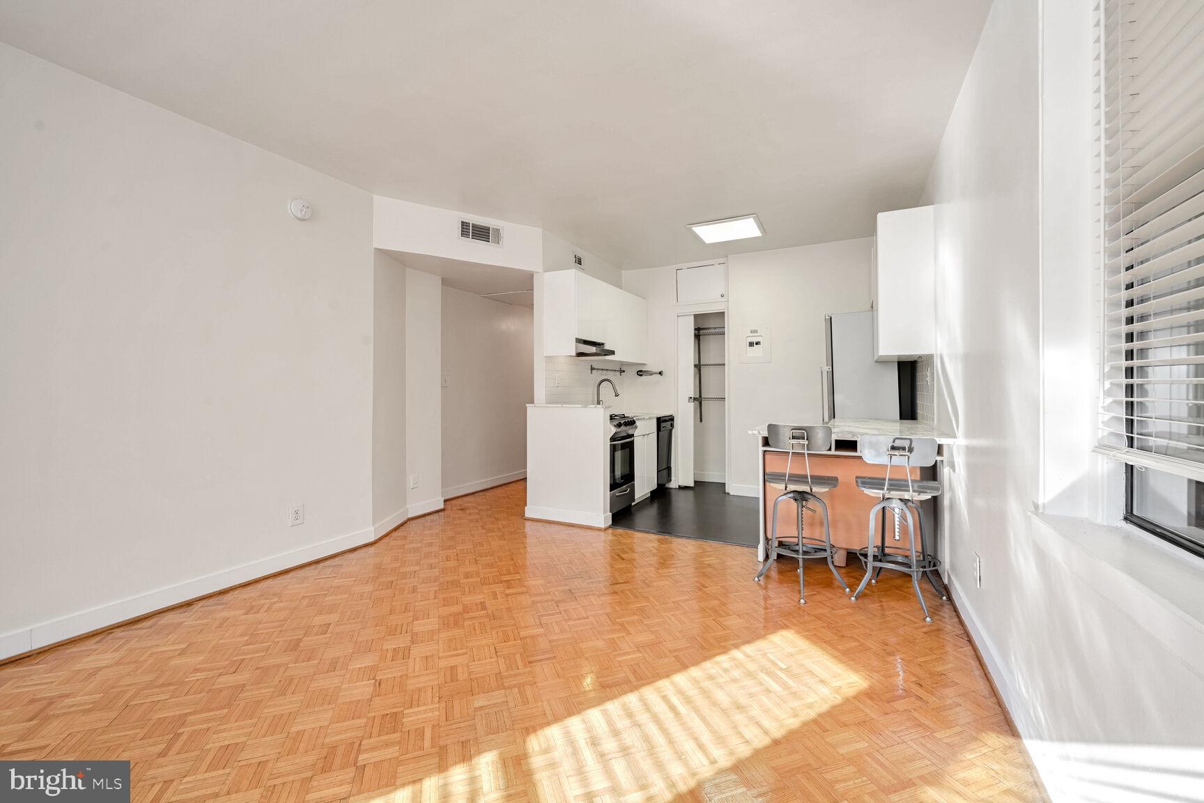 1669 Columbia Road Northwest, Unit 202 Washington, DC 20009 - Photo 5 of 13 Light-filled space. Notice pantry in kitchen.