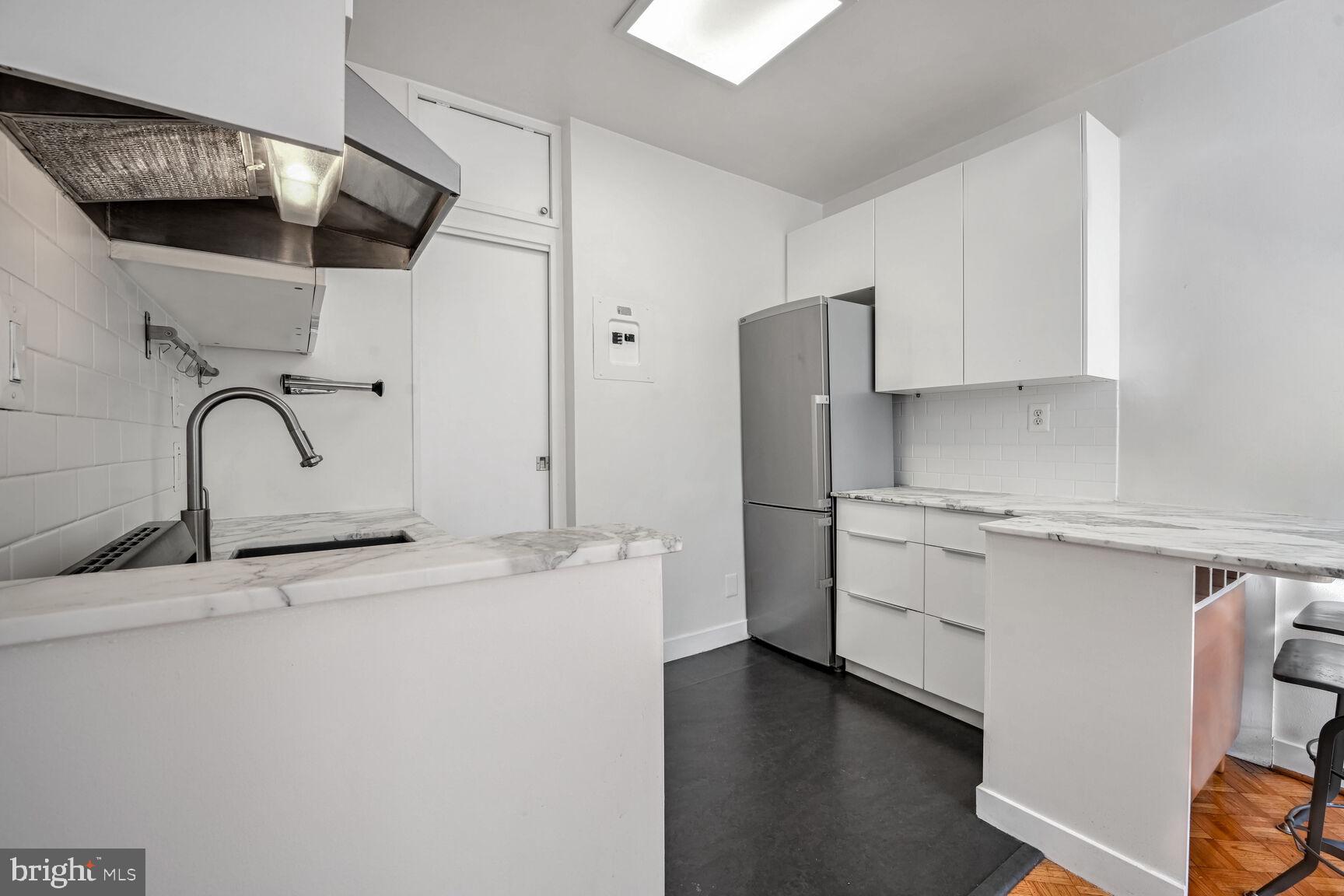1669 Columbia Road Northwest, Unit 202 Washington, DC 20009 - Photo 8 of 13 Updated kitchen with plenty of storage.