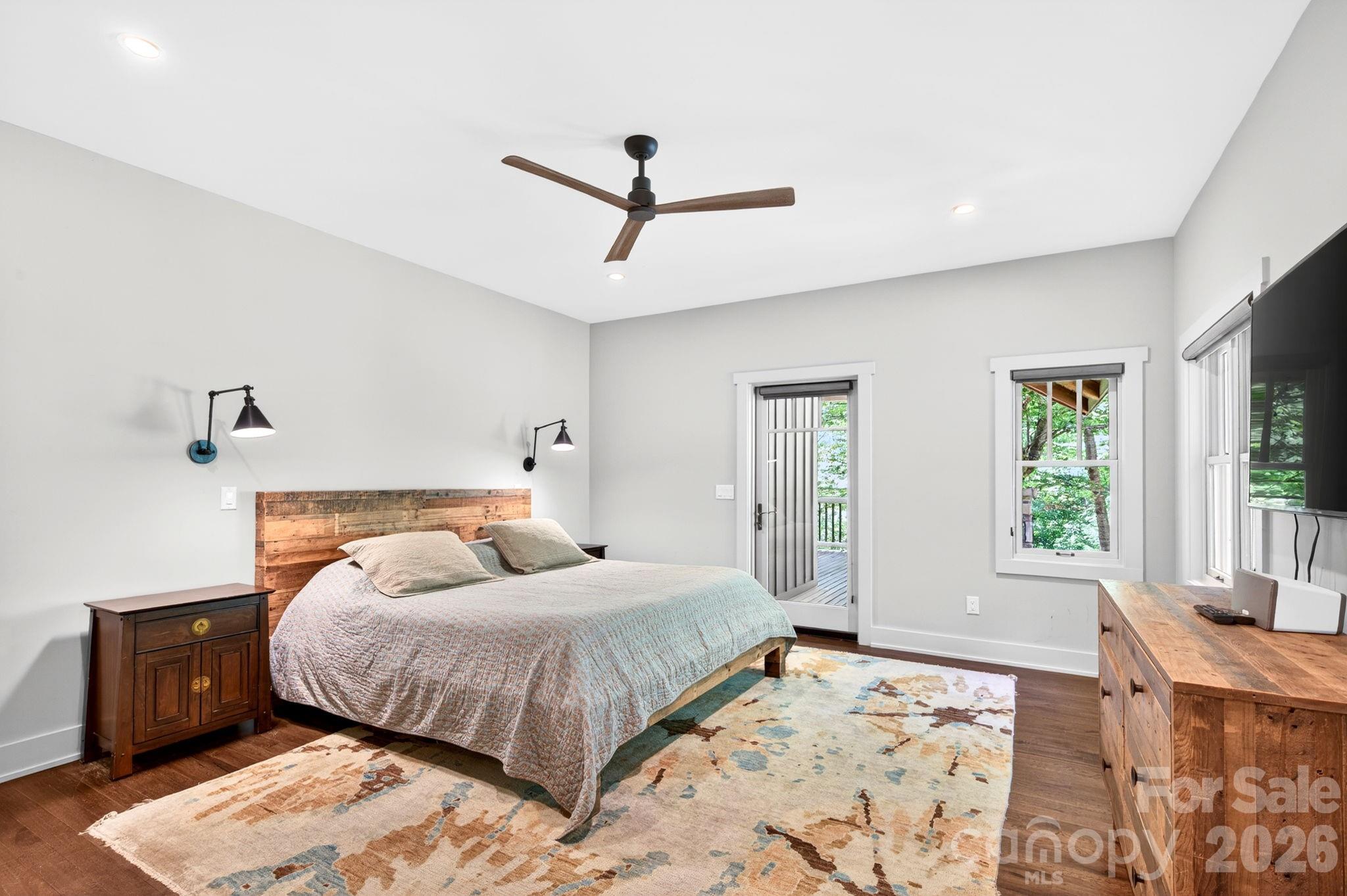 235 Bull Creek Road Asheville, NC 28805 - Photo 11 of 47 a bedroom with a large bed and a window