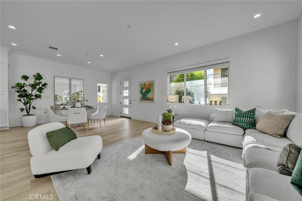 458 Chorus Irvine, CA 92618 - Photo 1 of 1 a living room with furniture and a large window