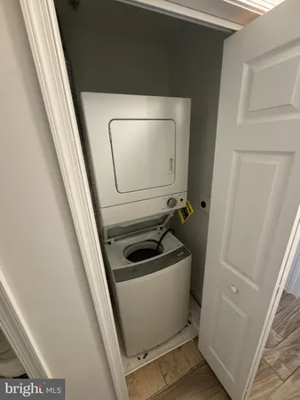 a bathroom with a sink and washing machine