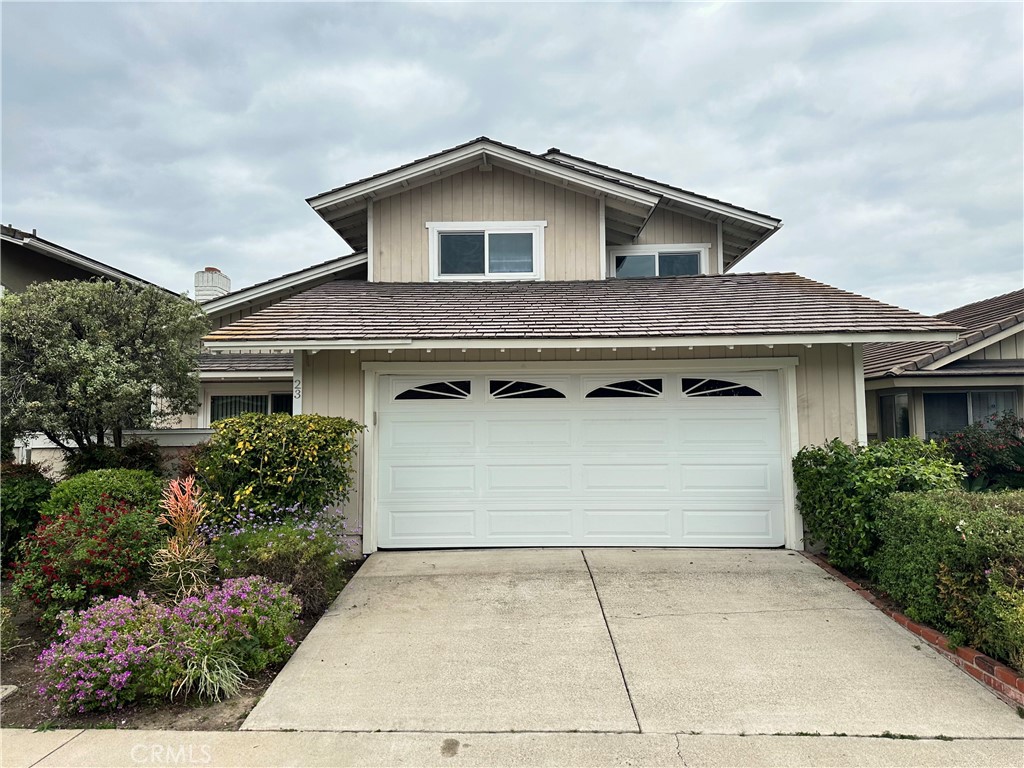 a front view of a house with parking space