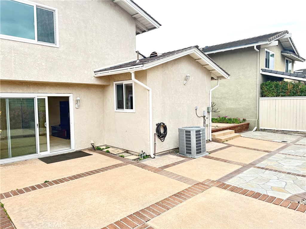 23 Whistling Swan Irvine, CA 92604 - Photo 20 of 26 a view of a house with a backyard and a garage