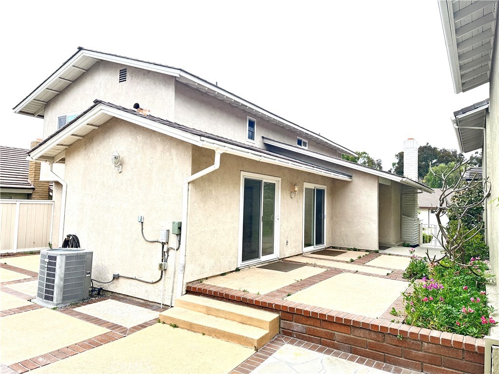 23 Whistling Swan Irvine, CA 92604 - Photo 21 of 26 a front view of a house with garage