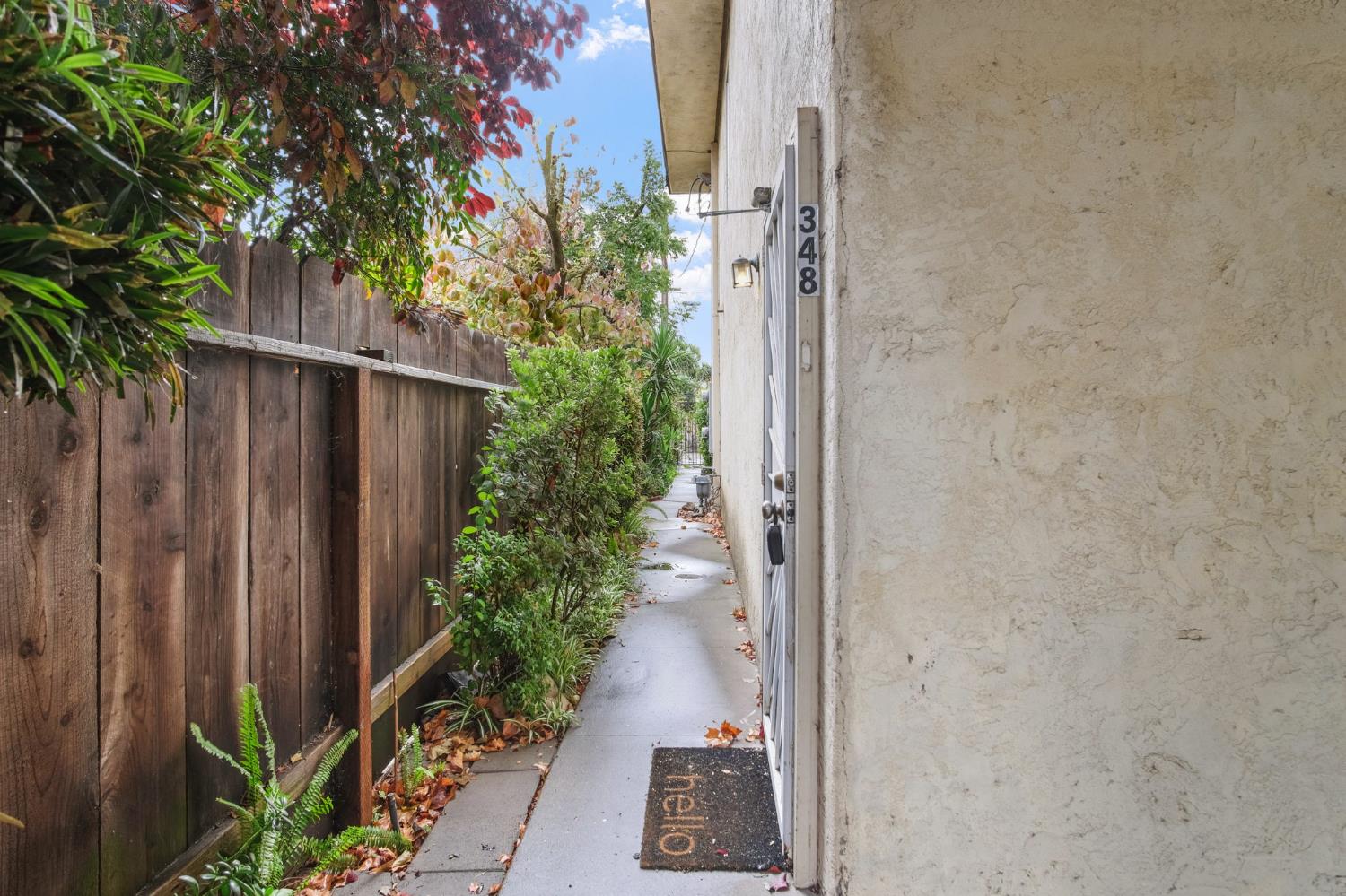 348 Wayside Drive Turlock, CA 95380 - Photo 22 of 22 a view of a pathway with a wooden fence
