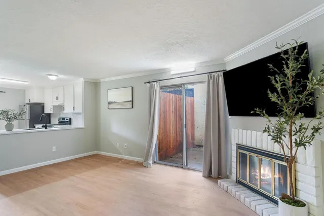 a view of livingroom with furniture and flat screen tv
