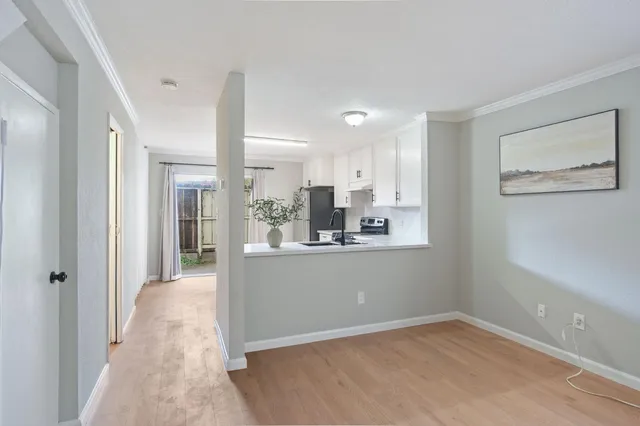 a view of kitchen with furniture and refrigerator