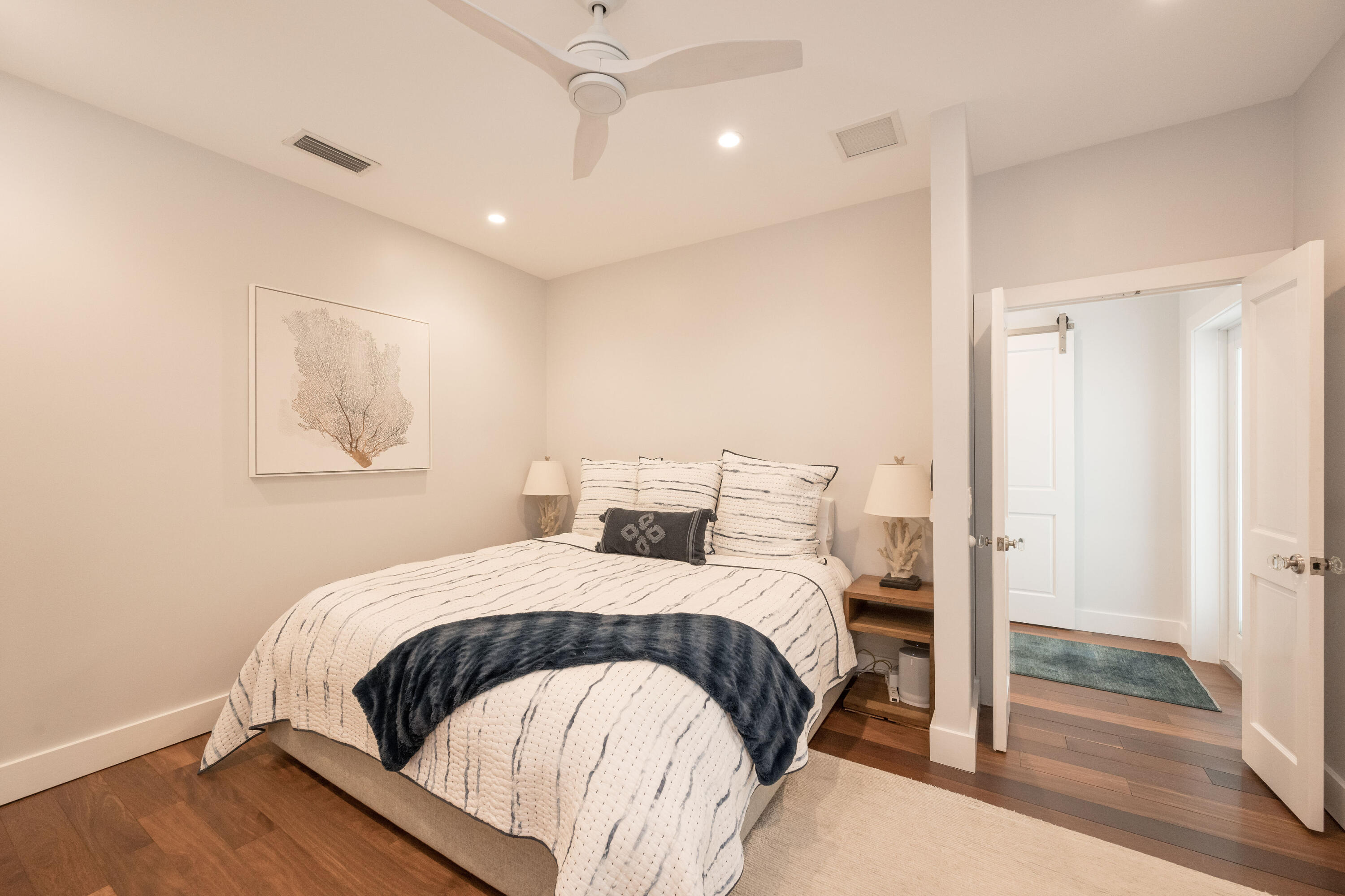 1231 Washington Street Key West, FL 33040 - Photo 11 of 41 a bedroom with a bed and a mirror