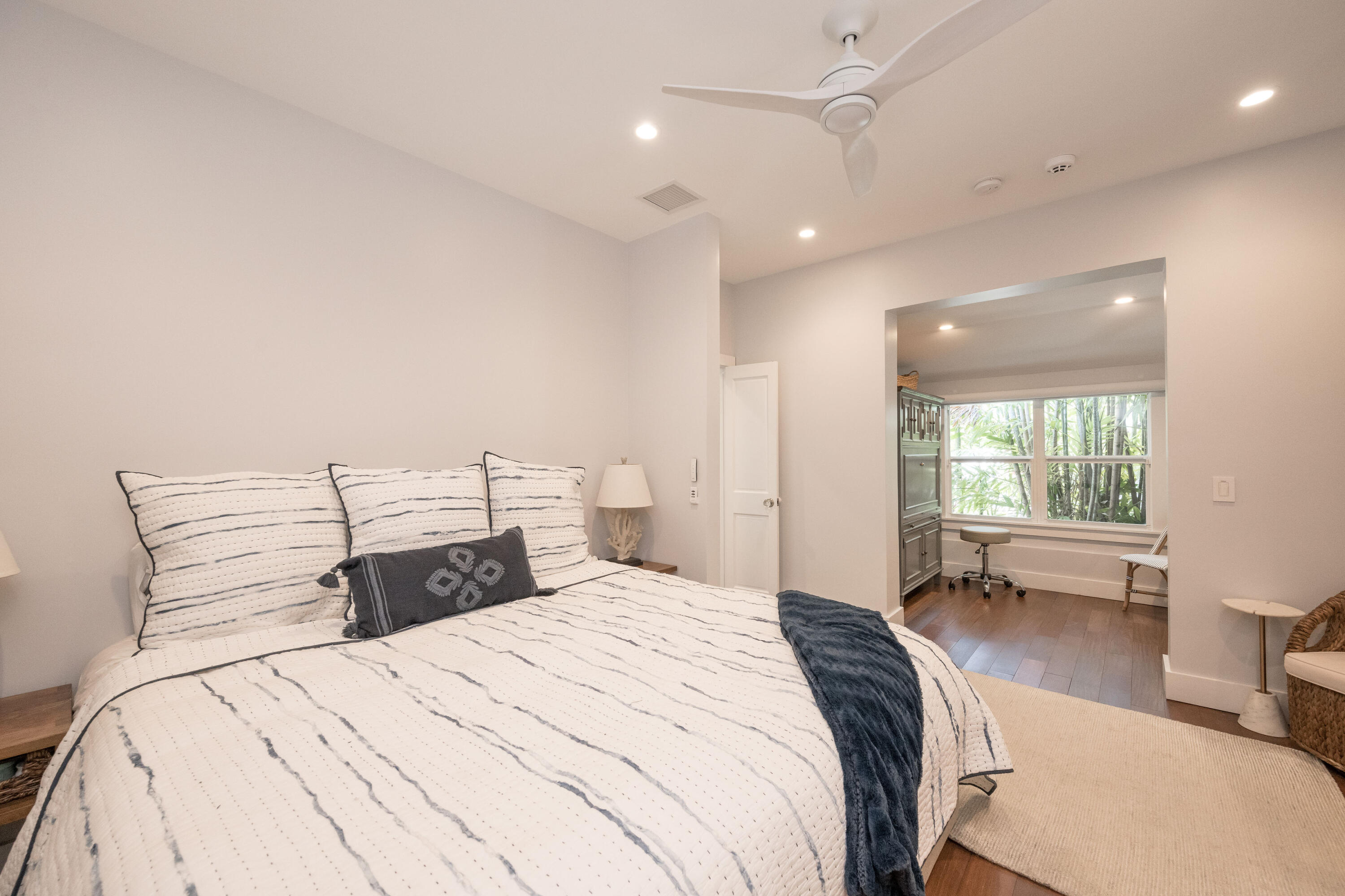 1231 Washington Street Key West, FL 33040 - Photo 12 of 41 a bedroom with a large bed and a large window