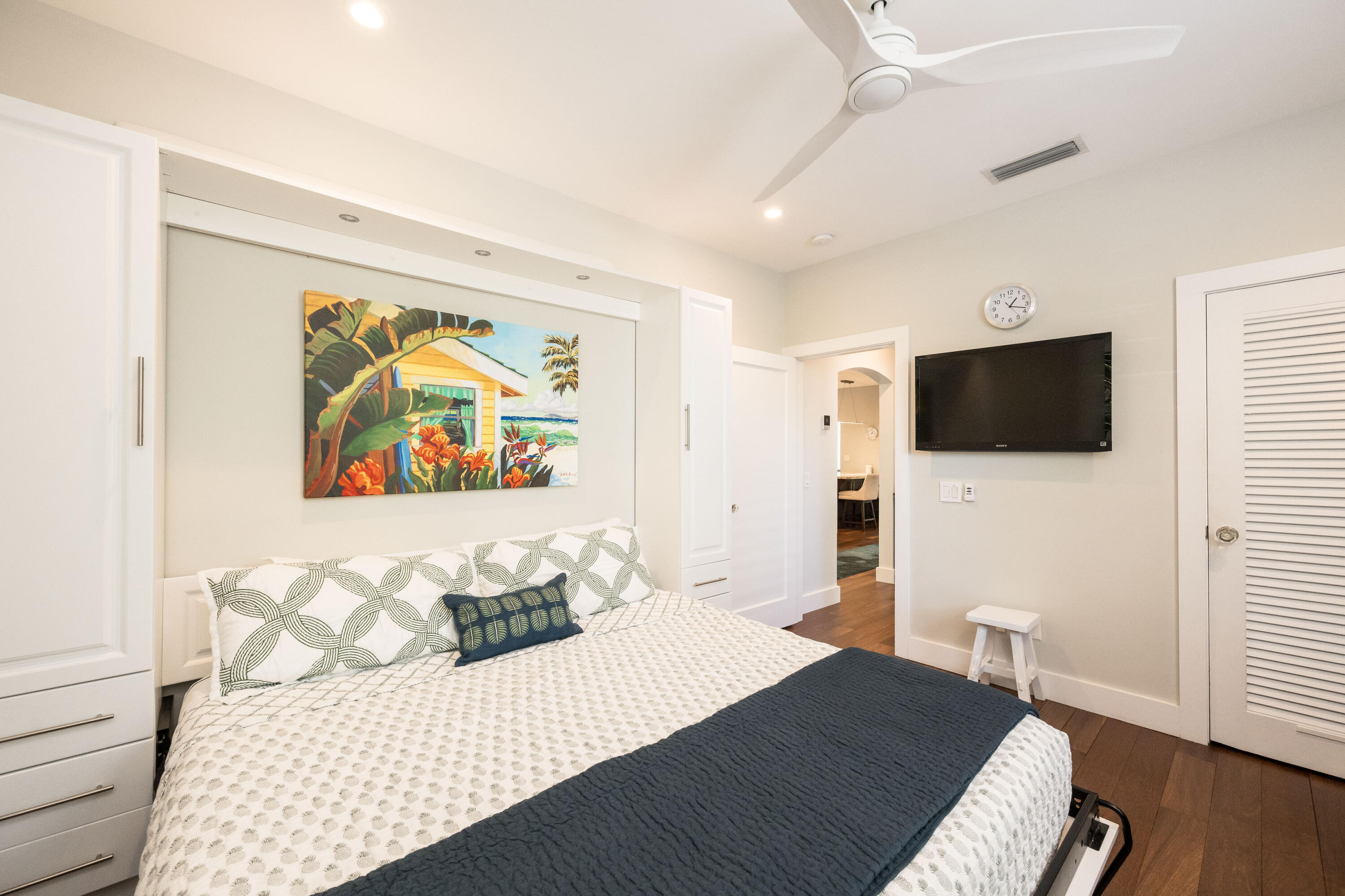 1231 Washington Street Key West, FL 33040 - Photo 21 of 41 a bedroom with a bed and a flat screen tv