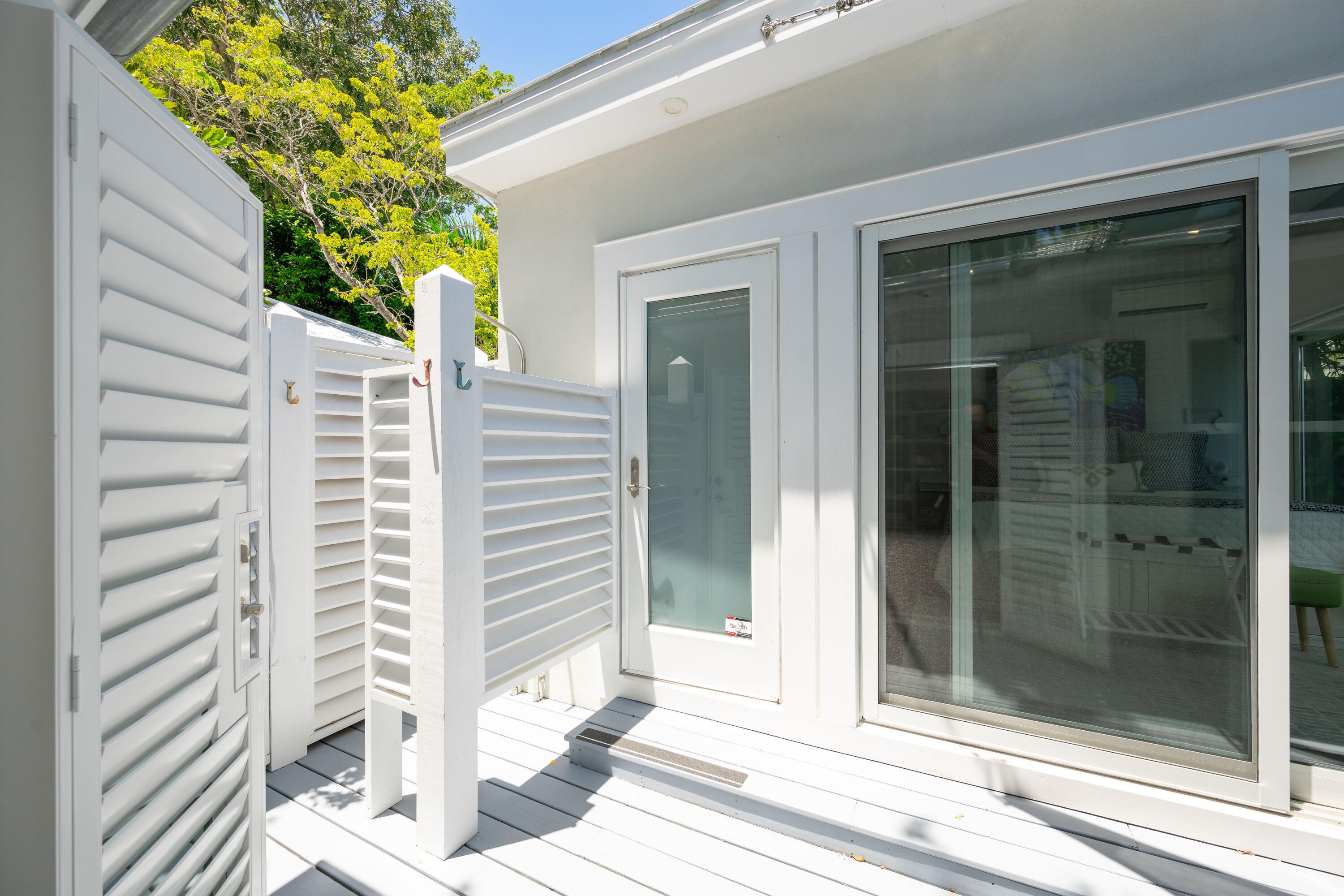 1231 Washington Street Key West, FL 33040 - Photo 32 of 41 a view of a porch with a door and a window