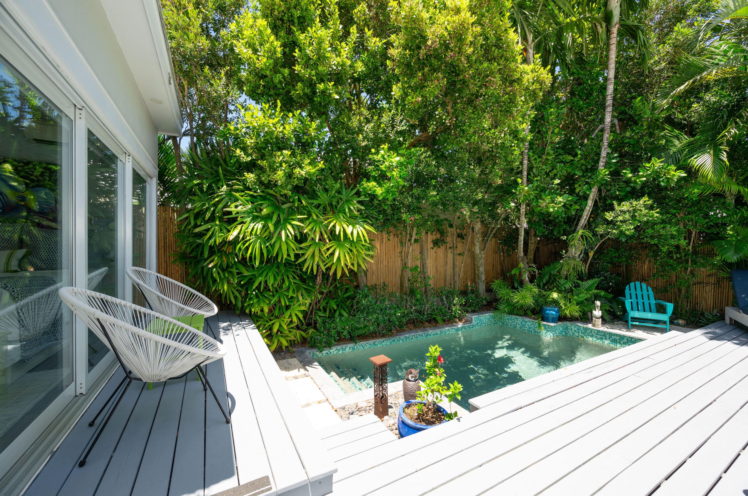 1231 Washington Street Key West, FL 33040 - Photo 34 of 41 a view of balcony with wooden floor and outdoor seating