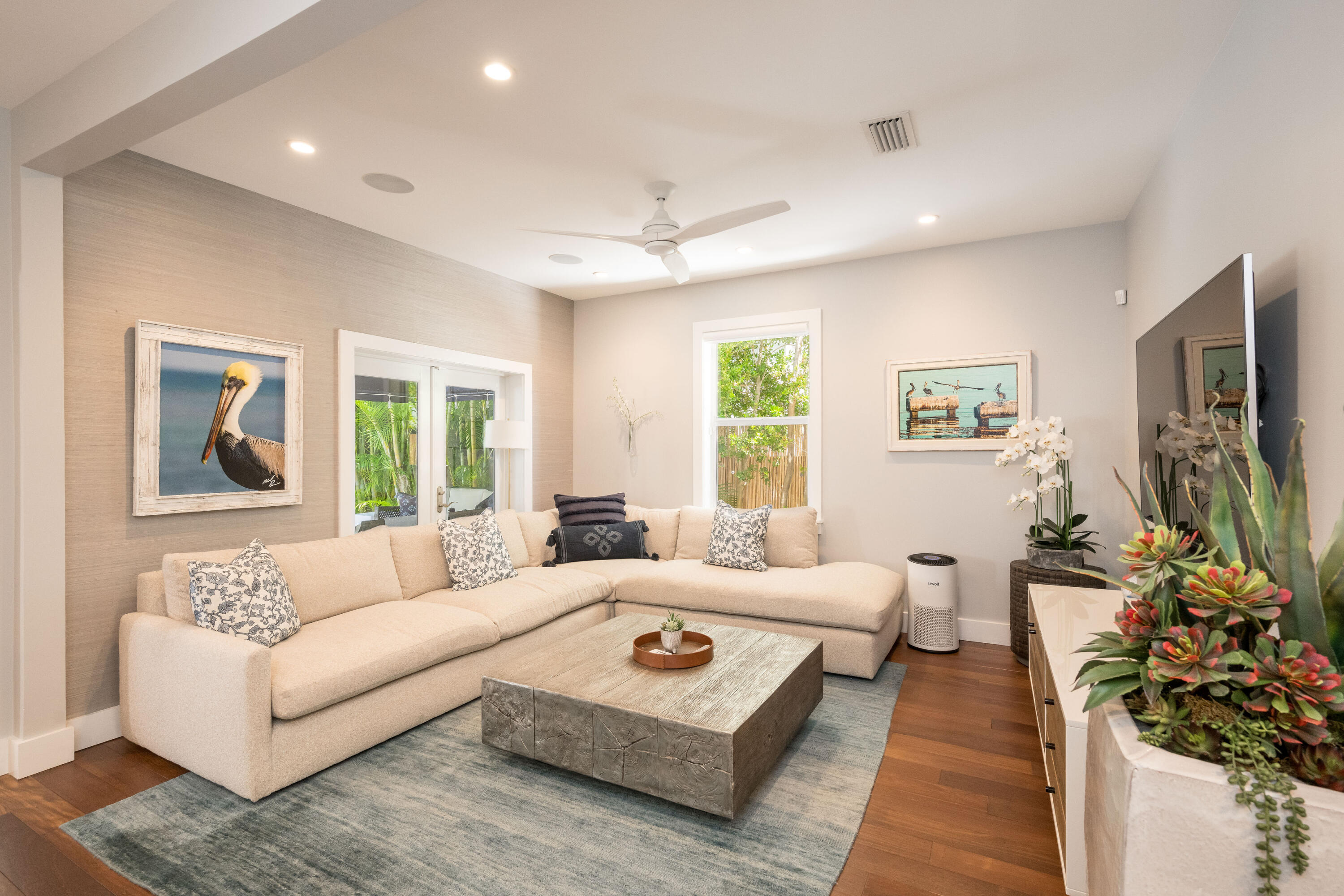 1231 Washington Street Key West, FL 33040 - Photo 4 of 41 a living room with furniture and a flat screen tv
