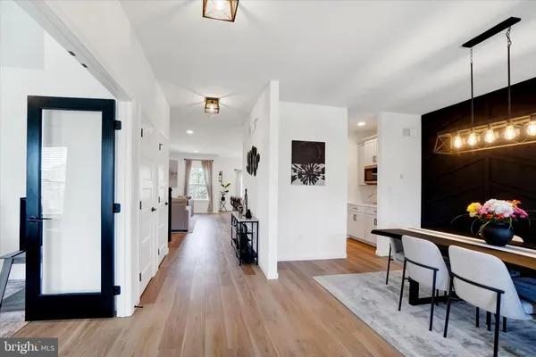 a view of a livingroom with furniture and a flat screen tv