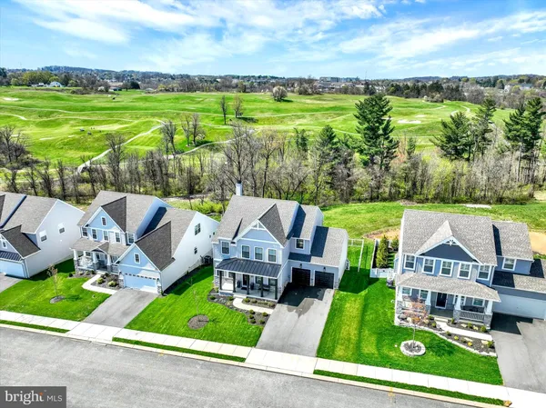 an aerial view of a house with big yard