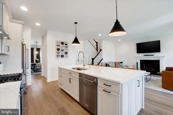 a view of living room with granite countertop furniture and fireplace