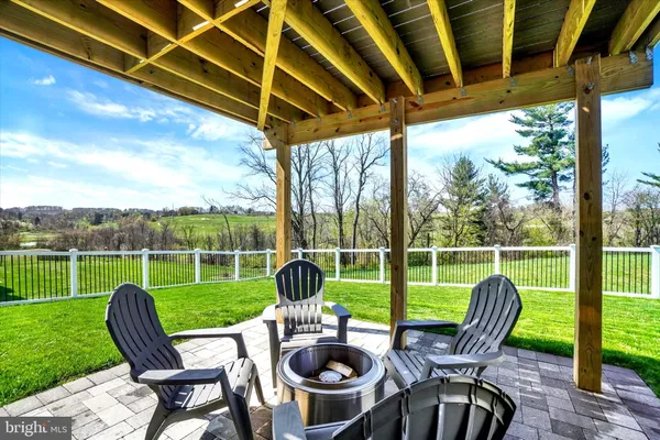 a view of a chair and table in the patio