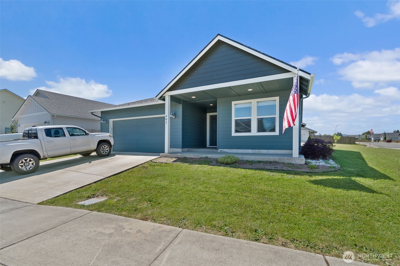 401 Cardinal Avenue Winlock, WA 98596 - Photo 39 of 39 a front view of a house with a garden and yard
