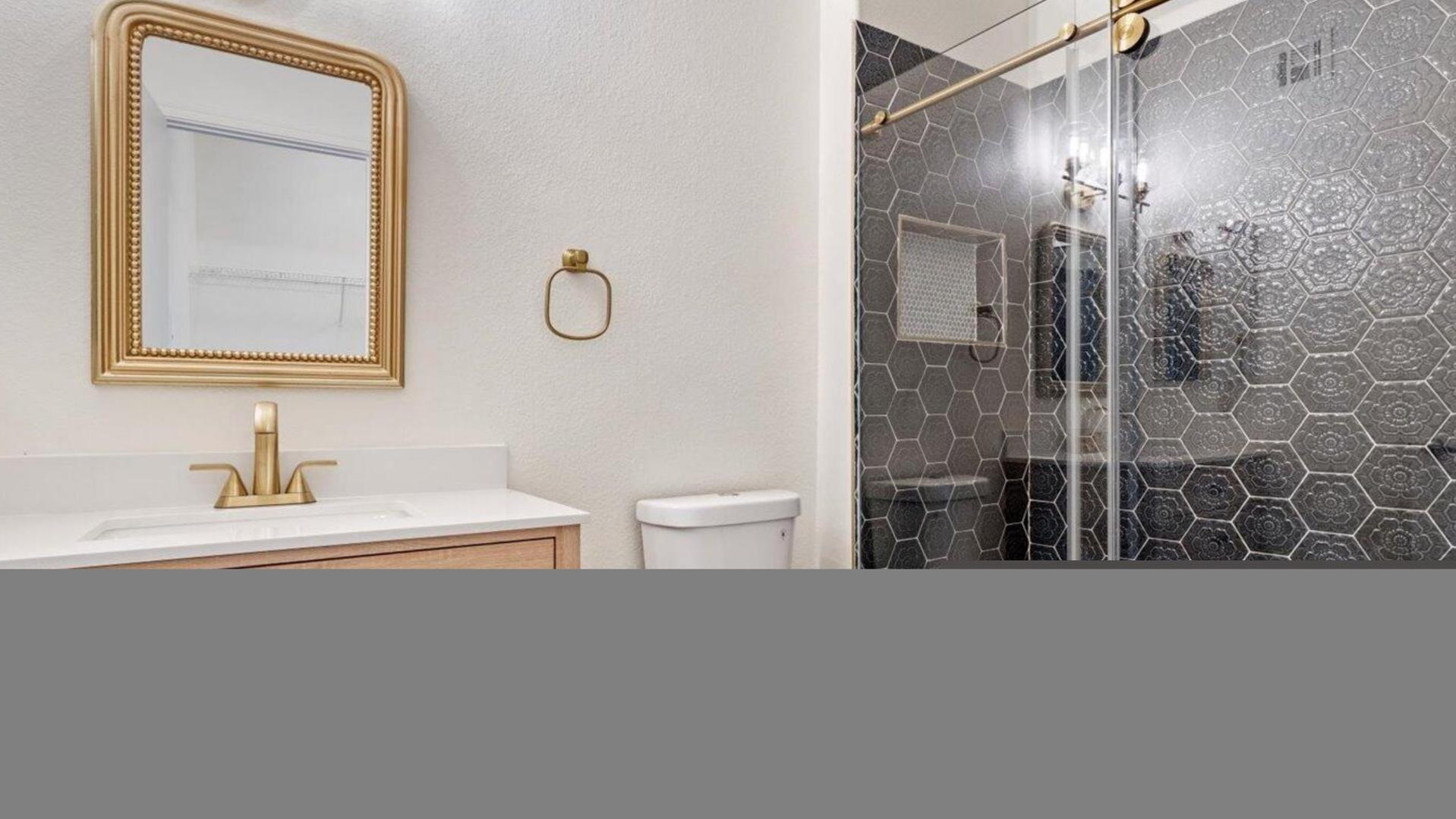 3434 East Baseline Road, Unit 260 Phoenix, AZ 85042 - Photo 1 of 19 a bathroom with a toilet a sink and mirror