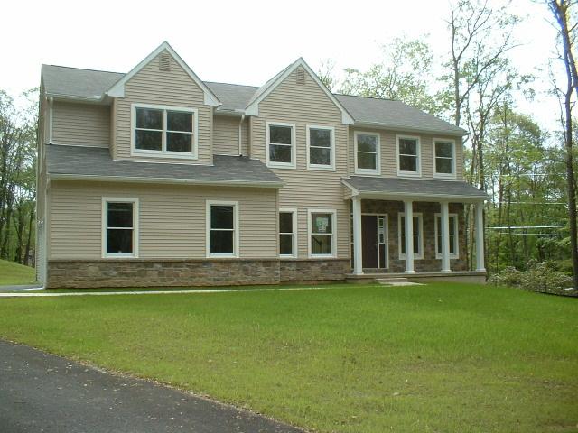 2 Summit Road Swiftwater, PA 18370 - Photo 1 of 8 a front view of a house with a garden