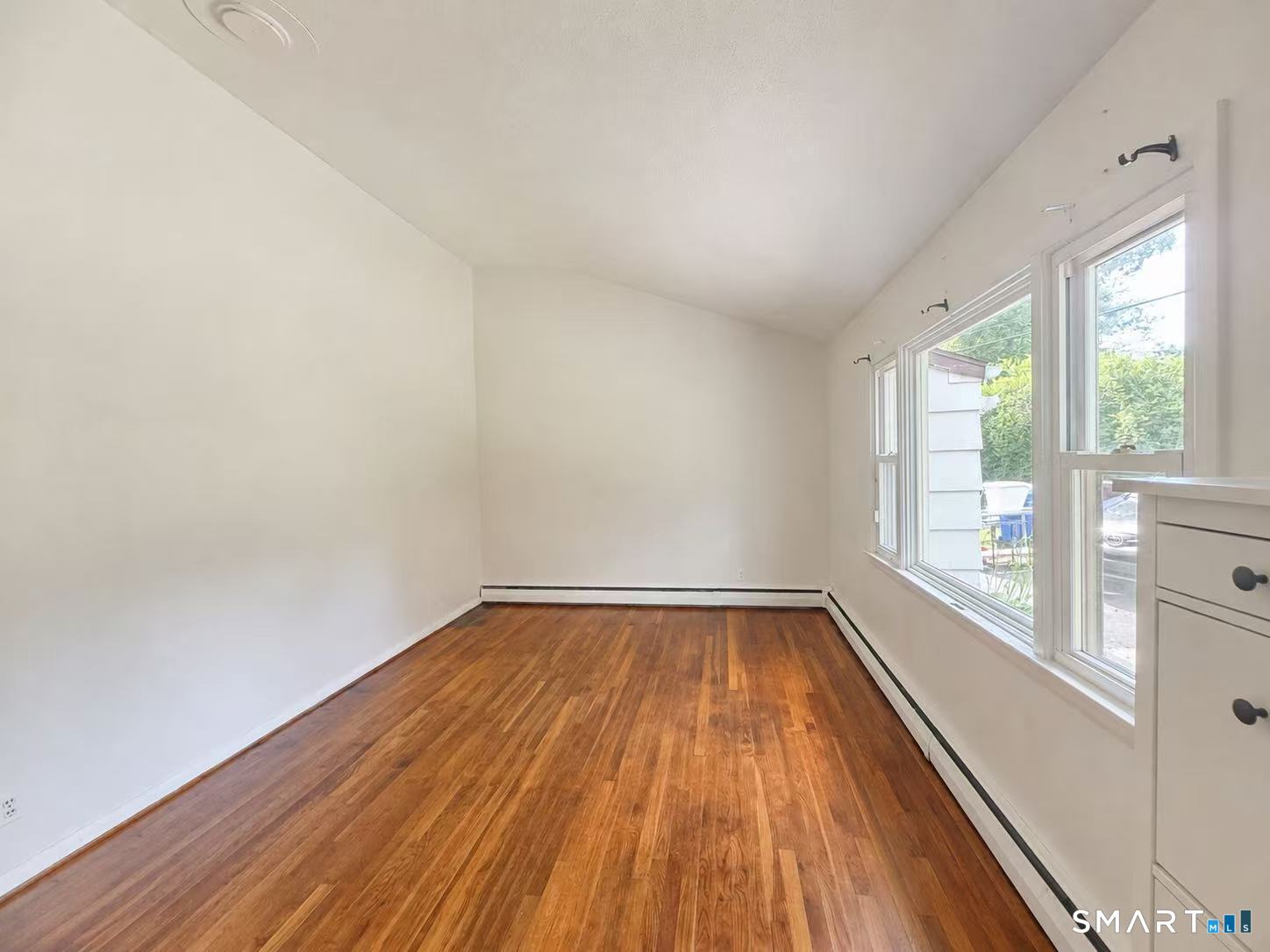 1122 Fienemann Road Farmington, CT 06032 - Photo 9 of 26 wooden floor in an empty room with a window