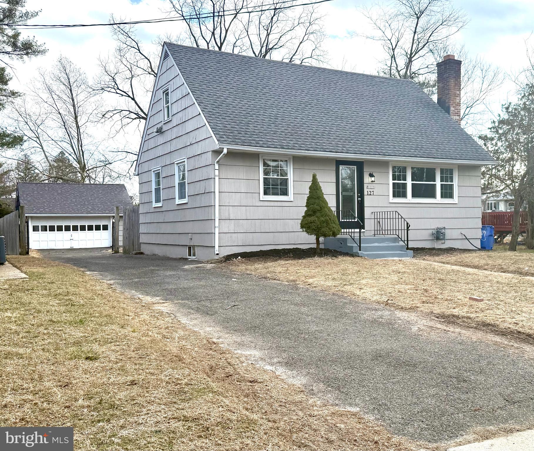 127 Madison Avenue Laurel Springs, NJ 08021 - Photo 1 of 22 a front view of a house with garden