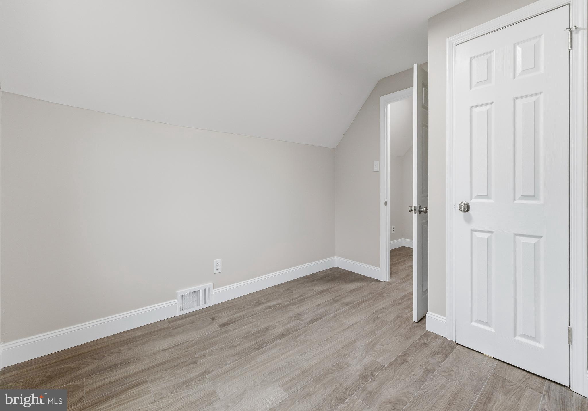 127 Madison Avenue Laurel Springs, NJ 08021 - Photo 11 of 22 a view of an empty room with wooden floor