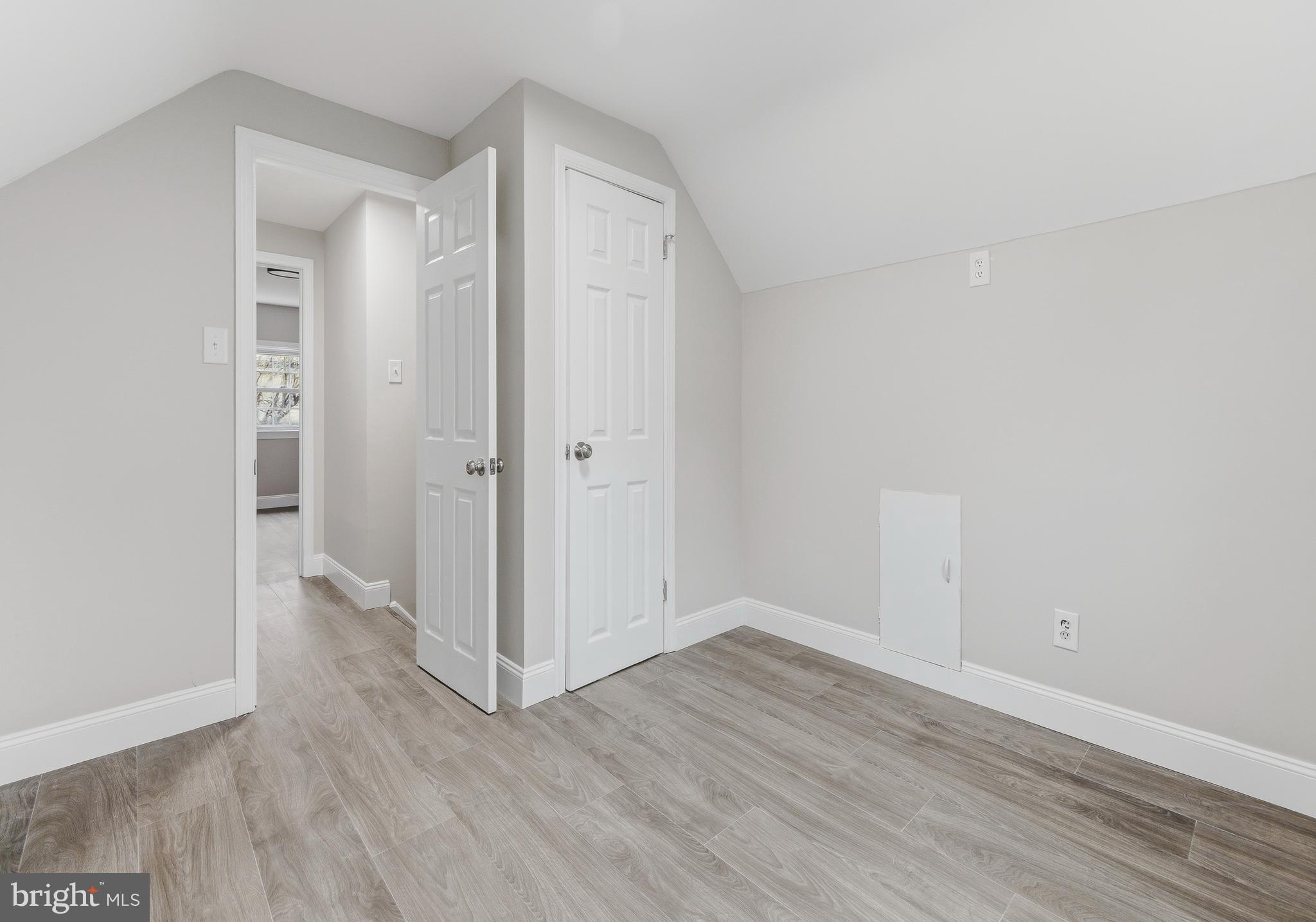 127 Madison Avenue Laurel Springs, NJ 08021 - Photo 12 of 22 a view of an empty room with wooden floor