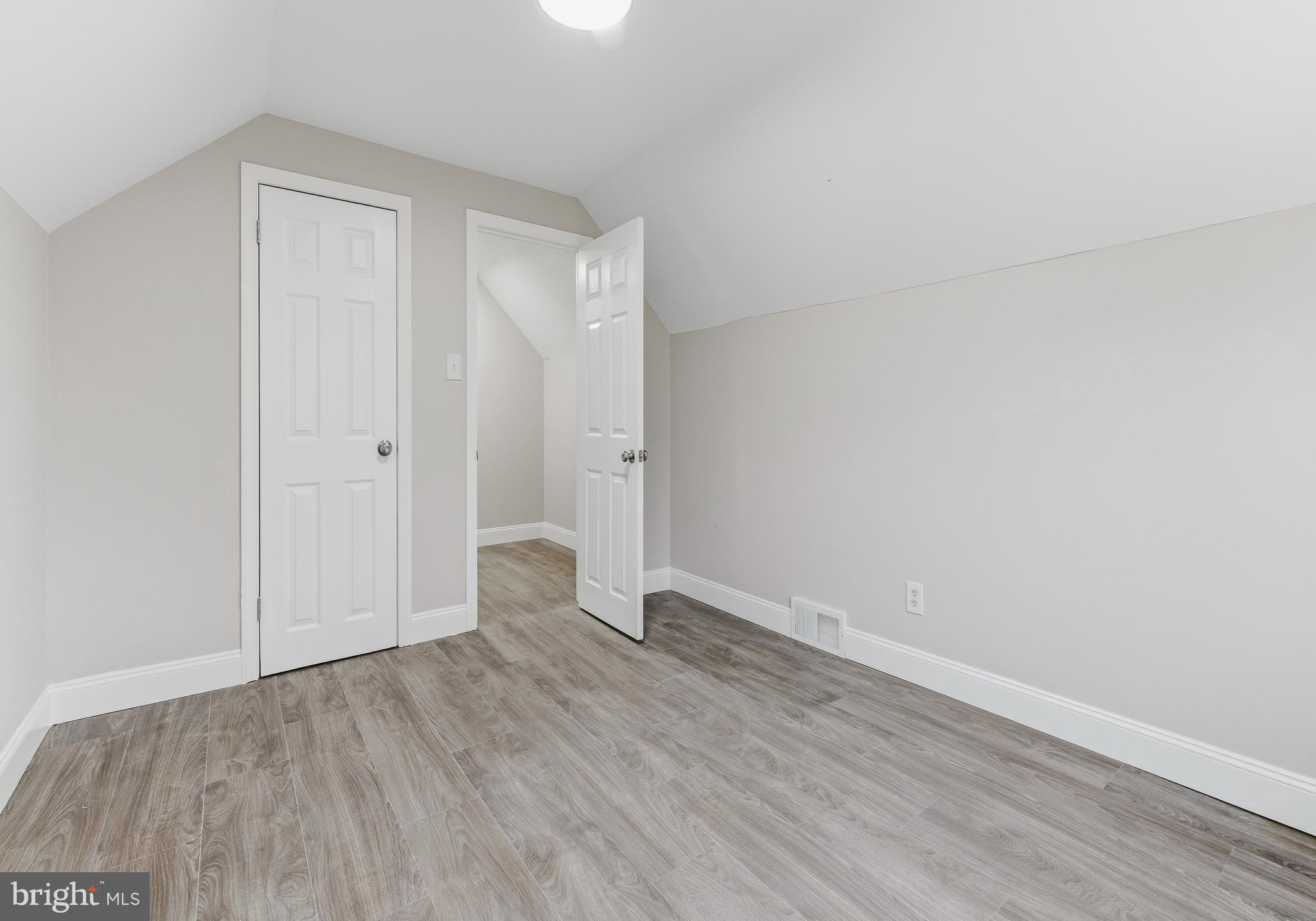 127 Madison Avenue Laurel Springs, NJ 08021 - Photo 13 of 22 a view of an empty room with wooden floor