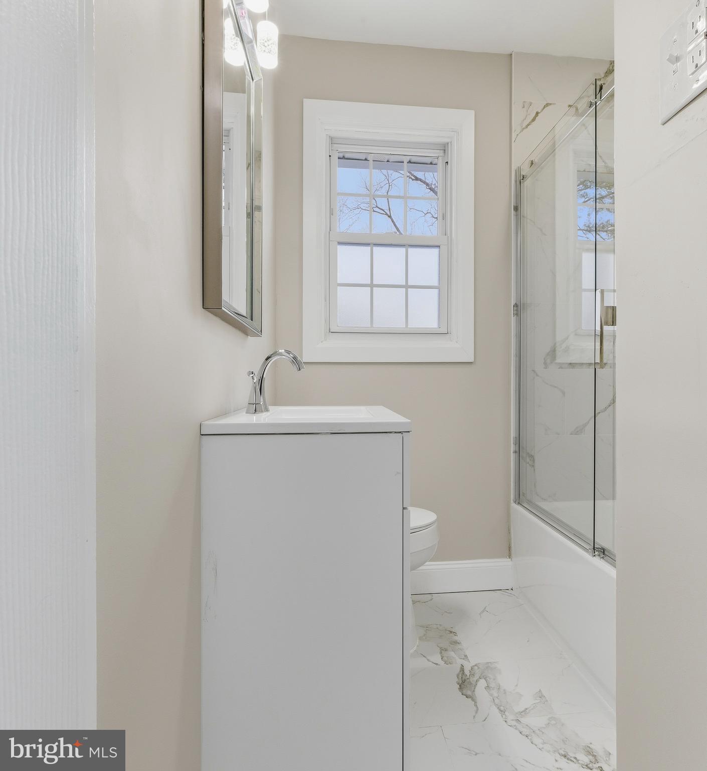 127 Madison Avenue Laurel Springs, NJ 08021 - Photo 15 of 22 a bathroom with a sink a toilet and shower
