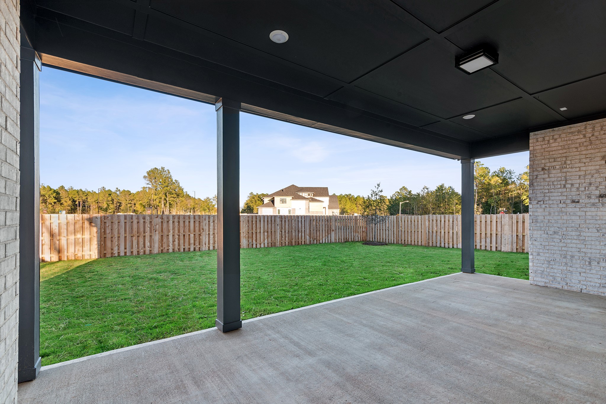 1752 Howler Way Montgomery, TX 77316 - Photo 34 of 41 REPRESENTATIVE PHOTO:Another view of rear patio! Great for relaxing or entertaining friends! Plumbed for gas and wired for speakers