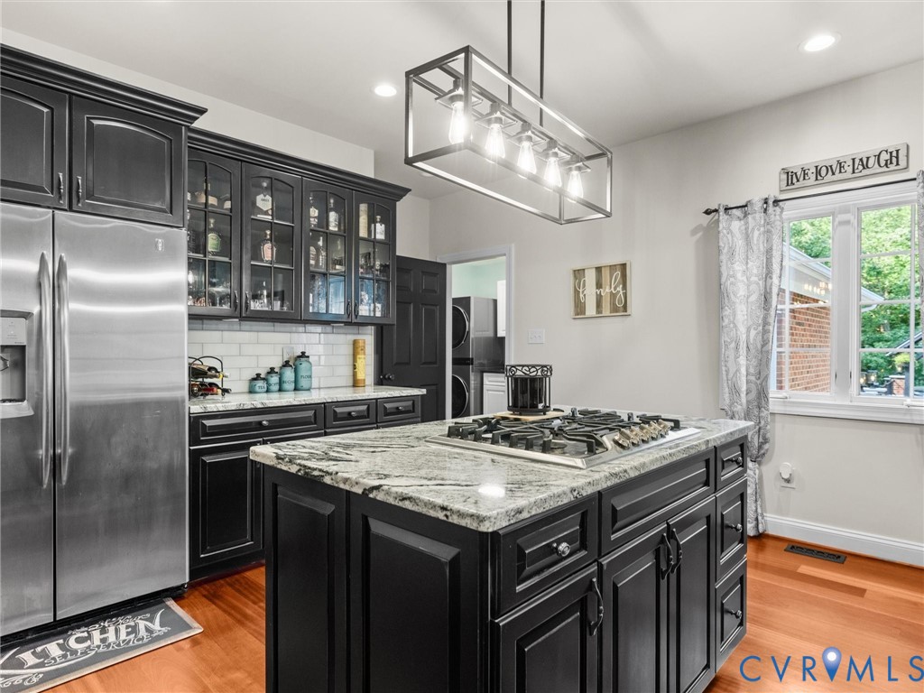 12710 Ivey Mill Road Chesterfield, VA 23838 - Photo 17 of 57 Kitchen featuring dark cabinetry, stainless steel