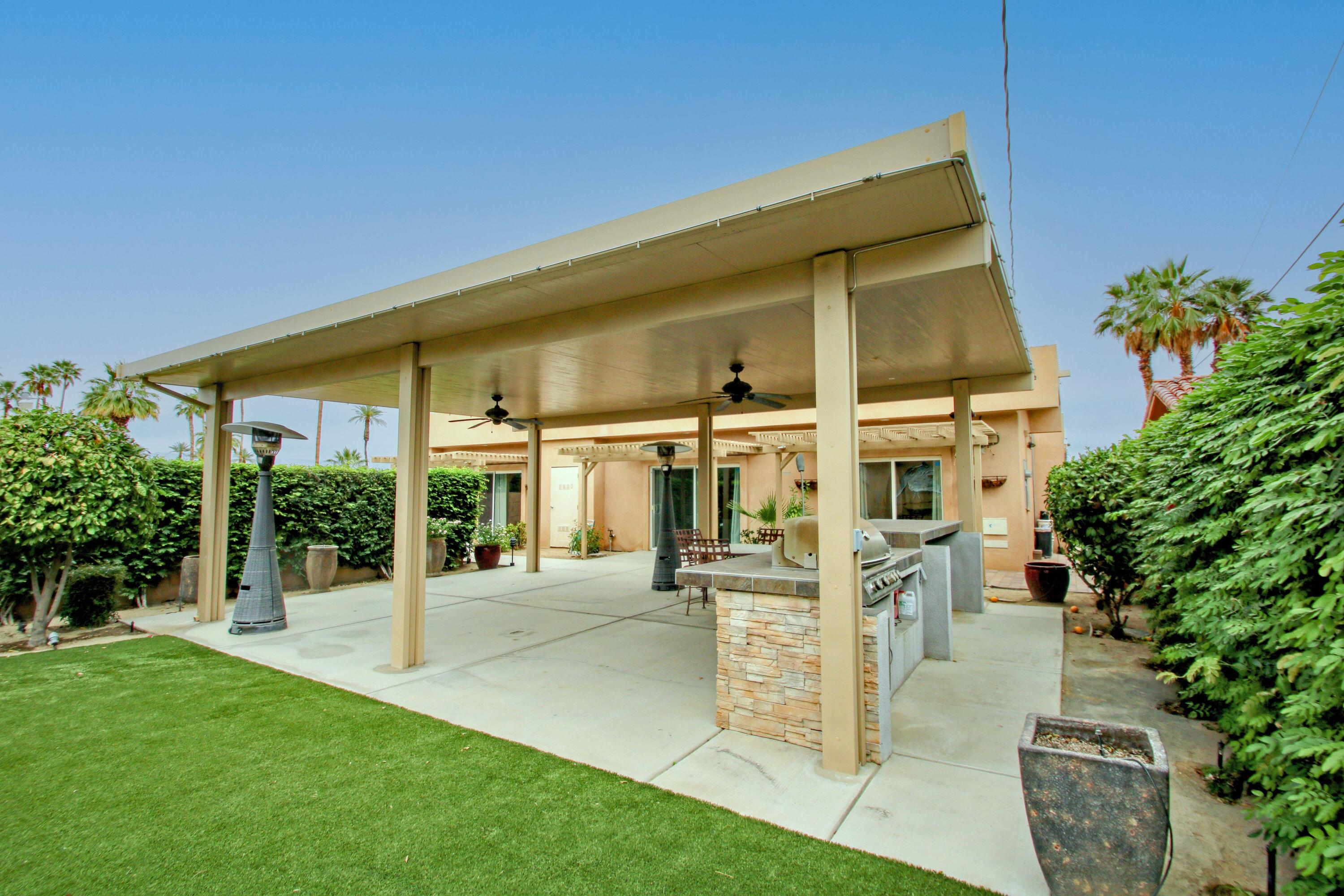 44755 Deep Canyon Road Palm Desert, CA 92260 - Photo 13 of 16 a view of a house with a yard and potted plants