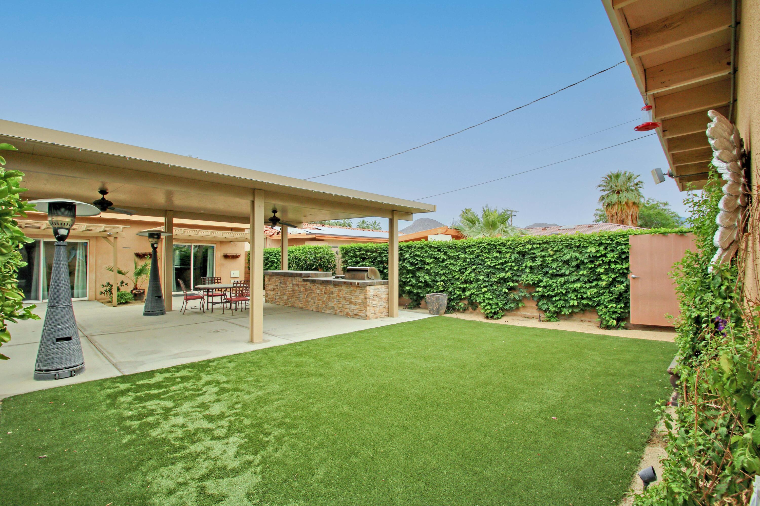 44755 Deep Canyon Road Palm Desert, CA 92260 - Photo 14 of 16 a view of a porch and garden