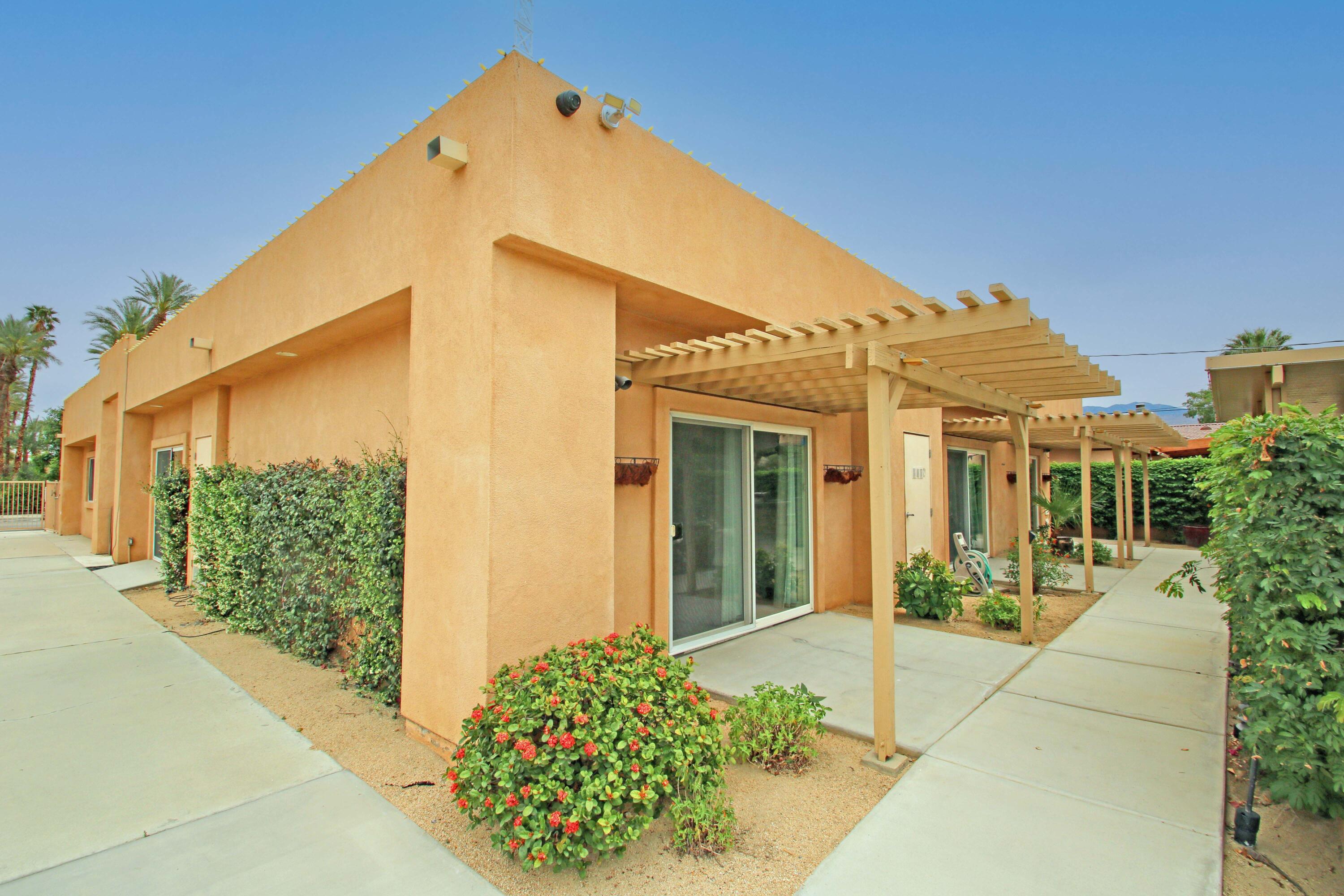 44755 Deep Canyon Road Palm Desert, CA 92260 - Photo 15 of 16 a view of a house with potted plants
