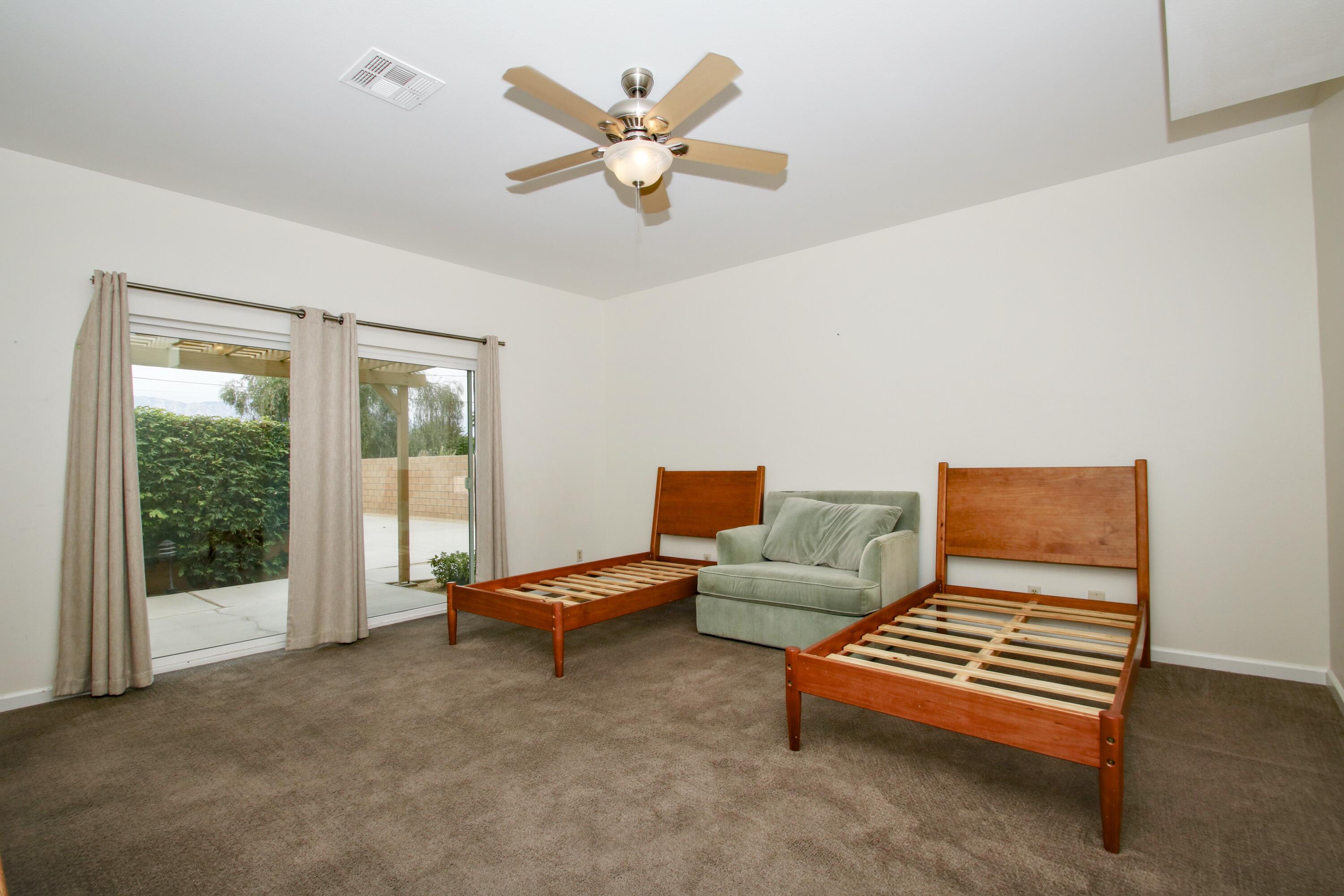 44755 Deep Canyon Road Palm Desert, CA 92260 - Photo 7 of 16 a living room with furniture and a window