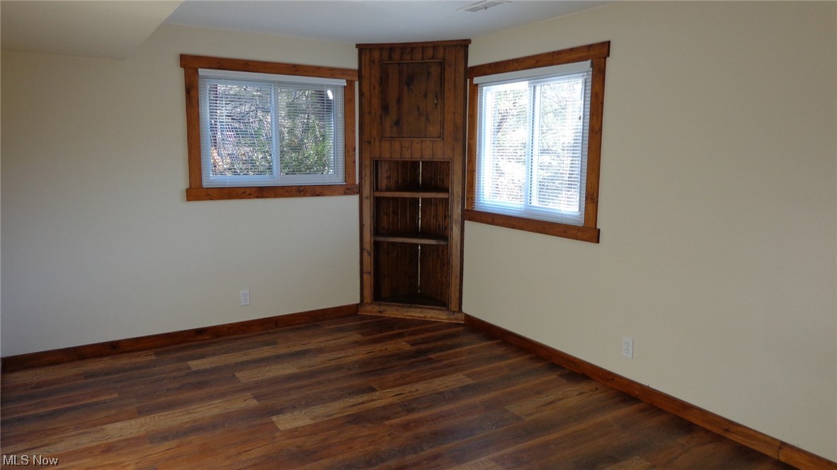 10157 Ravenna Road Chardon, OH 44024 - Photo 31 of 34 Spare room with dark hardwood / wood-style floors