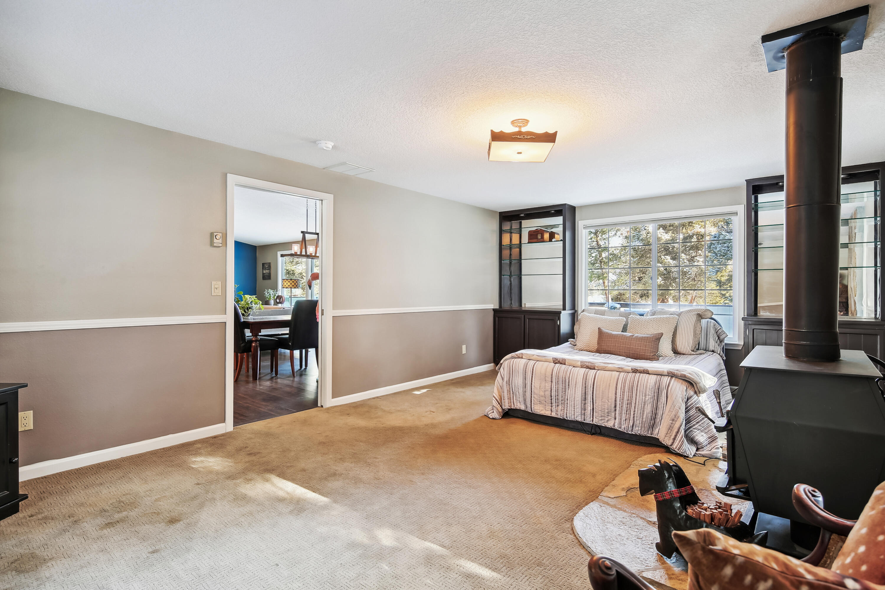 20466 Mainline Road Bend, OR 97702 - Photo 13 of 35 a bedroom with bed and window