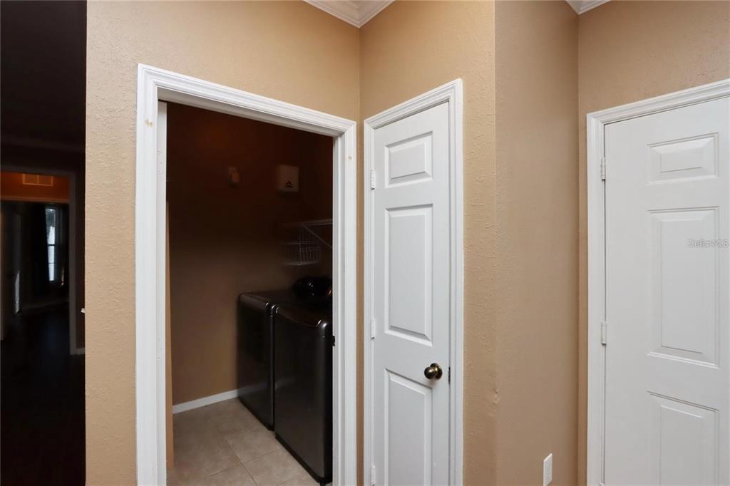 9918 Courtney Palms Boulevard, Unit 201 Tampa, FL 33619 - Photo 22 of 24 a view of a hallway
