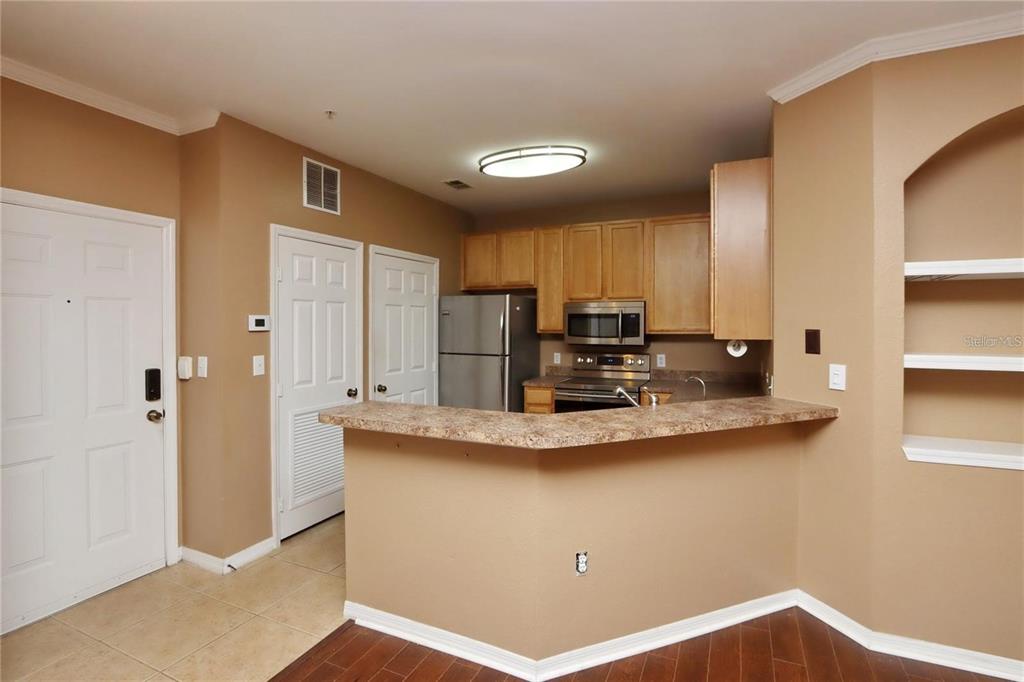 9918 Courtney Palms Boulevard, Unit 201 Tampa, FL 33619 - Photo 8 of 24 a view of kitchen with counter top space