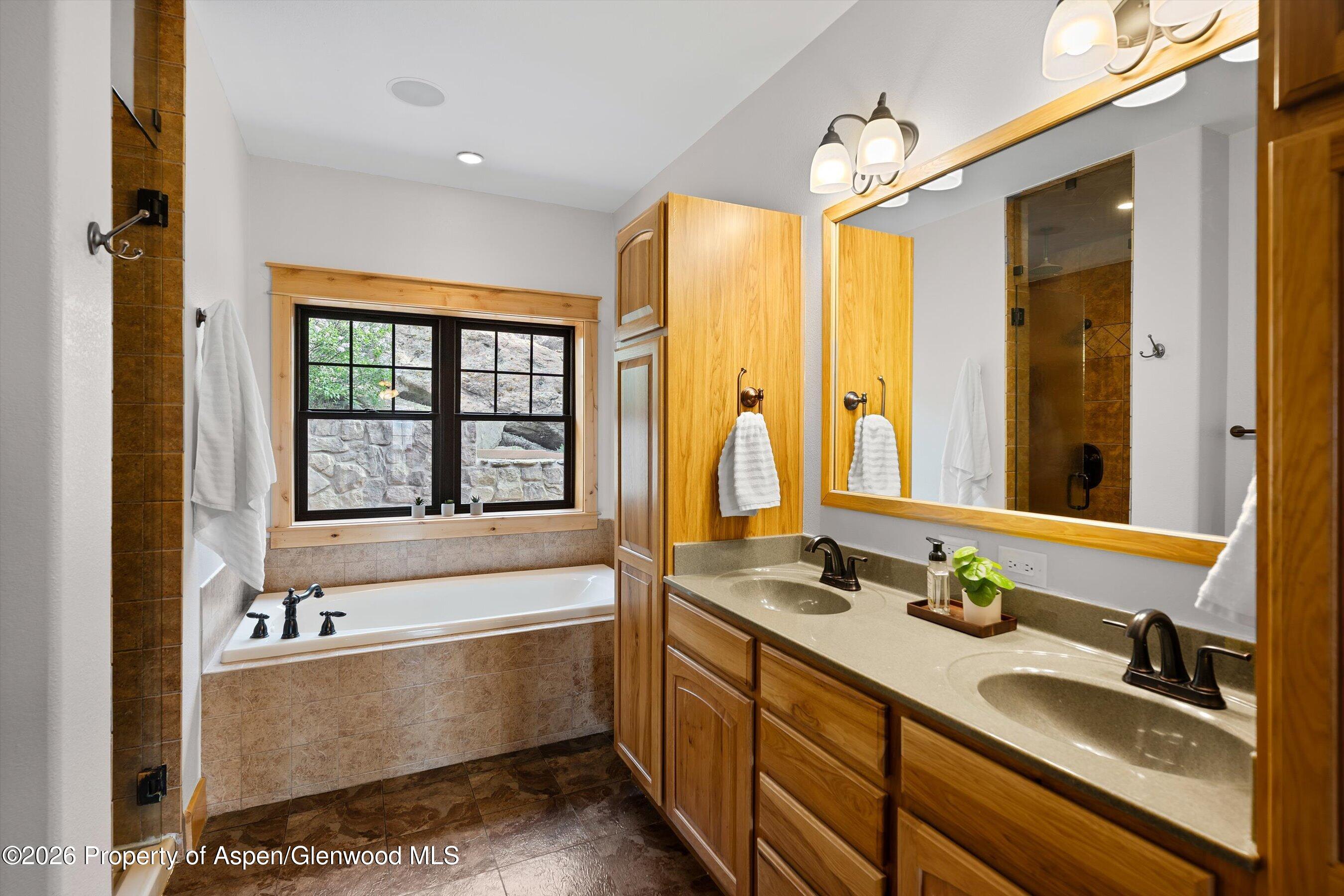 450 Summer Falls Road Silt, CO 81652 - Photo 17 of 50 a bathroom with a bathtub and a sink