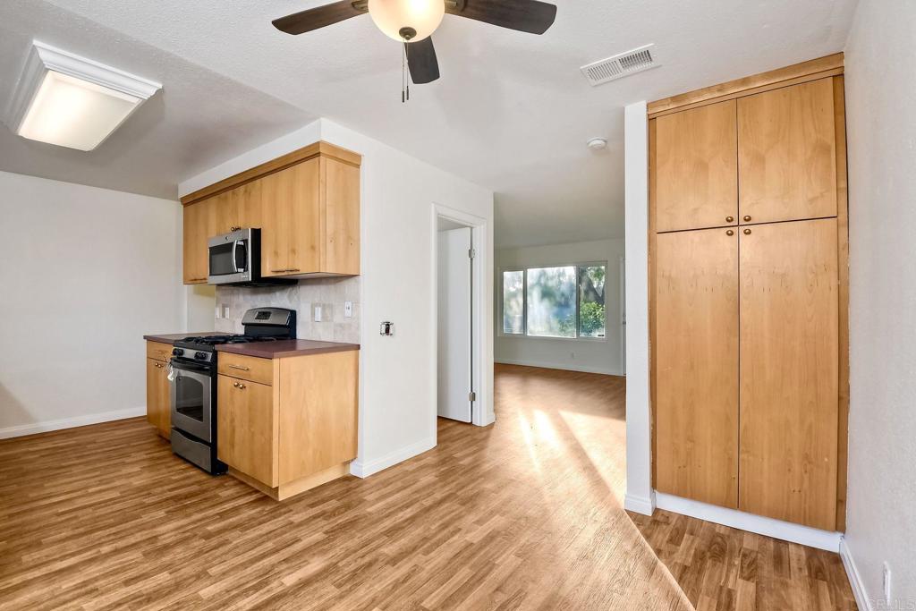 3605 Surfline Way Oceanside, CA 92056 - Photo 12 of 32 a view of kitchen with furniture and wooden floor