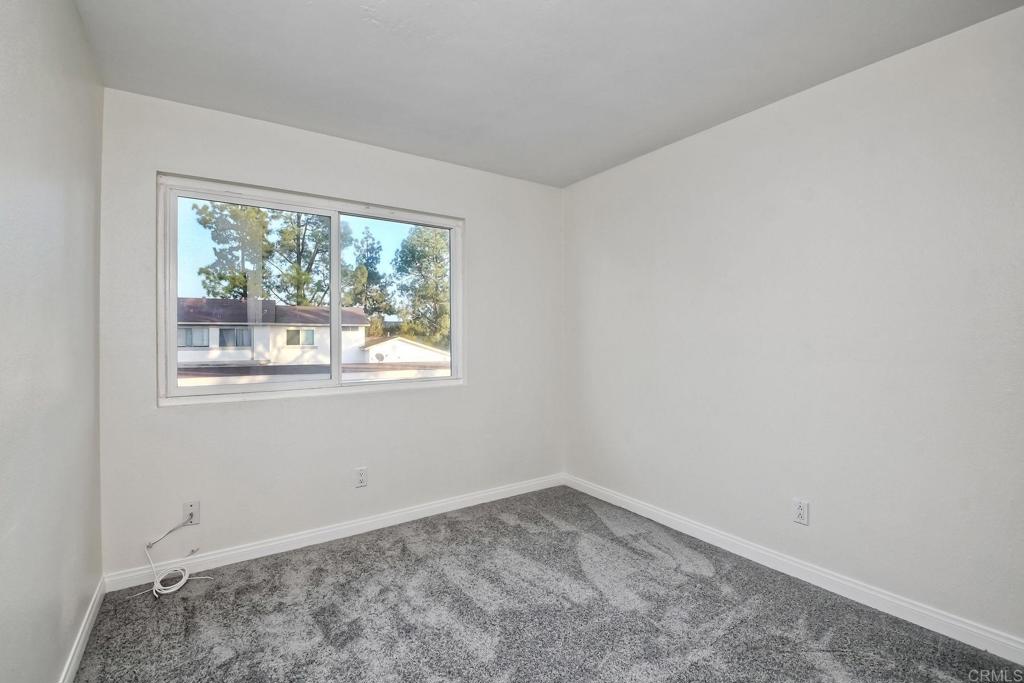 3605 Surfline Way Oceanside, CA 92056 - Photo 22 of 32 an empty room with a window