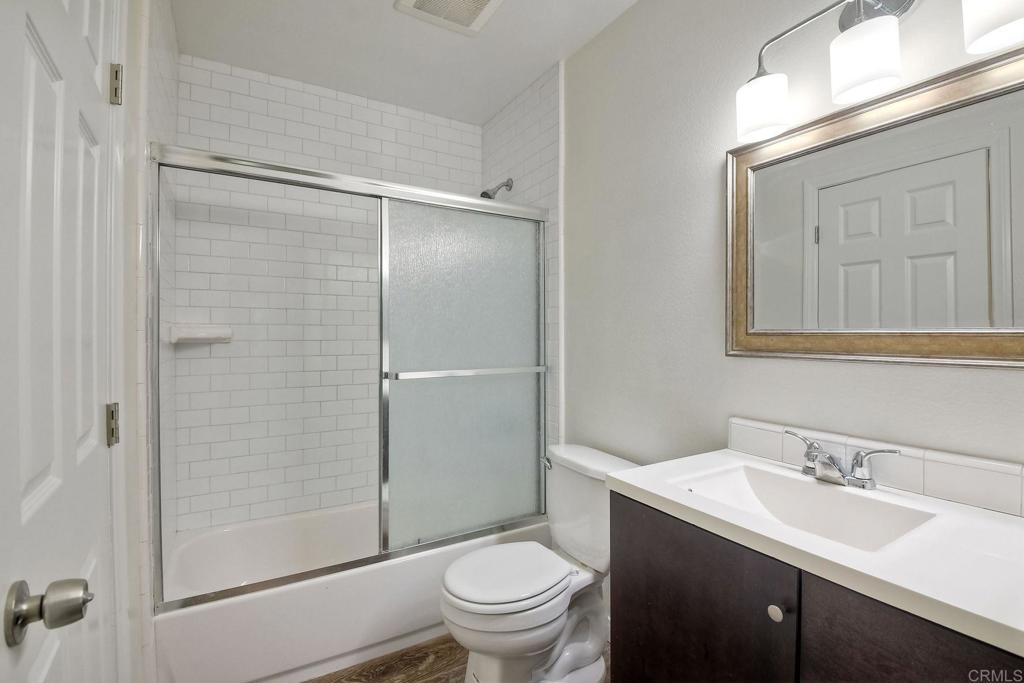 3605 Surfline Way Oceanside, CA 92056 - Photo 28 of 32 a bathroom with a sink toilet and shower